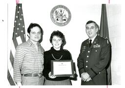 Schweppe, Man, and Woman Posing with Award (Part of the NMU Historic Photographs Collection)