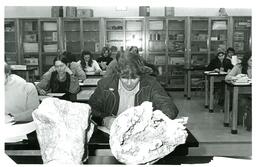 Student Looking at Rock (Part of the NMU Historic Photographs Collection)