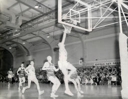 NMC Basketball--Aquinas Basketball 1960-61: Different View of Basketball Players on Court During Game