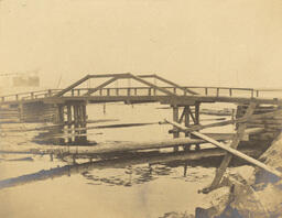 Wooden bridge in front of industrial building