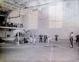 (158-01) Track--Northern vs. Wayne 1960: Discus Player Watched by Crowd