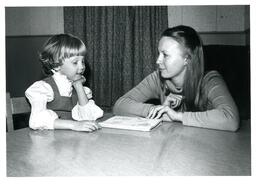 Woman Speaks with Small Child (Part of the NMU Historic Photographs Collection)