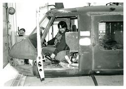 Man Sitting Inside Helicopter Body (Part of the NMU Historic Photographs Collection)