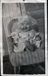 Baby with Bonnet in Chair (1 of 2)