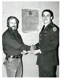 Two Men Shaking Hands and Holding Piece of Paper (Part of the NMU Historic Photographs Collection)