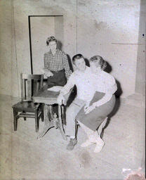 Masquers--"Enemy of the People" 1959: Woman Sitting on Man's Lap on Set