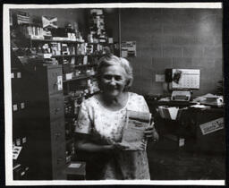 Woman Holding Sunset Hour Book