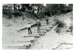 Three Construction Workers Standing on Beach Stairs (Part of the NMU Historic Photographs Collection)