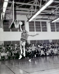 Basketball--NMC vs. Michigan Tech at Michigan Tech Feb. 22, 1961: College Basketball Player Attempting to Dunk the Basketball