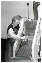 Man Collecting a Liquid Sample (Part of the NMU Historic Photographs Collection)