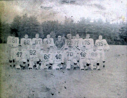 Coach Ferzacca (center) ca. 1960: Coach Ferzacca Posed in Center with Team Members