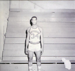 NMC Basketball--Individual Pictures 1960-61: Basketball Player No. 34 Posing for Photo