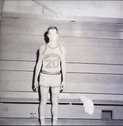 NMC Basketball--Individual Pictures 1960-61: Basketball Player No. 20 Posing for Photo