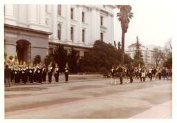 Marching Band Performing in Front of Large Building and Palm Tree (Part of the NMU Historic Photographs Collection)