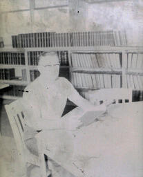 Benn Jerzyk, Menominee, NMC Student May 17, 1961: Benn Jerzyk Sitting with Book