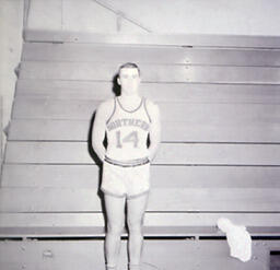 NMC Basketball--Individual Pictures 1960-61: Basketball Player No. 14 Posing for Photo