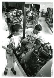 Students Looking at Machine (Part of the NMU Historic Photographs Collection)