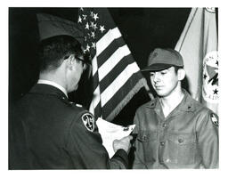 Man in Military Uniform Reading Something to Another Man in a Military Uniform (Part of the NMU Historic Photographs Collection)