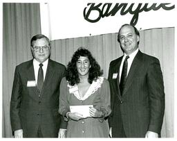 Two Men and a Woman Posing with Award at Banquet (Part of the NMU Historic Photographs Collection)