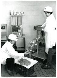 Two Kitchen Staff Making Burgers with Food Processor (Part of the NMU Historic Photographs Collection)