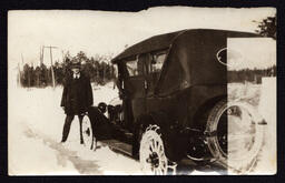 Man next to Car in Snow