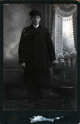 Young Man with Chair by Window