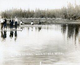 People in Raft and Canoe at Big Spring