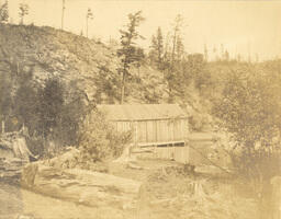 Wooden building on edge of lake