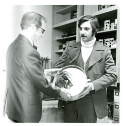 John X. Jamrich Smiling at Circular Mirror (Part of the NMU Historic Photographs Collection)