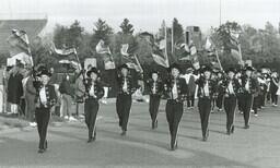 Color Guard of Marching Band Performing in Parade (Part of the NMU Historic Photographs Collection)