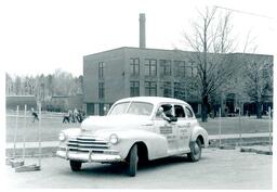 Man Parallel Parking a Driver Training Car (Part of the NMU Historic Photographs Collection)