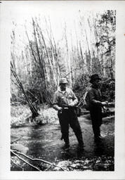 Men Fishing in River