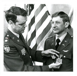 Lieutenant Allen Pinning Medal onto Unknown Man (Part of the NMU Historic Photographs Collection)