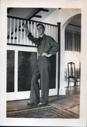 Serviceman Leaning on Stair Rail