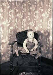 (026-003) Baby in Chair (Child of Mr. and Mrs. Harry Newton, Jr.)