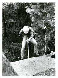 View from Above of Person Rappelling Down Cliff (Part of the NMU Historic Photographs Collection)