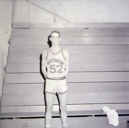 NMC Basketball--Individual Pictures 1960-61: Basketball Player No. 52 Posing for Photo