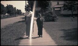 (008-012) Two Children Posing in front of Travelrest Haven Rooms