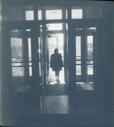 Former Campus Scenes: Woman in Doorway