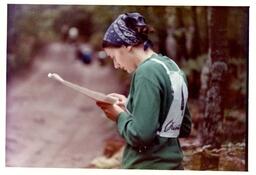 Competitor Standing on Side of Road Looking at Piece of Paper (Part of the NMU Historic Photographs Collection)