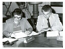 Mrs. G. Katherine Wright and Dr. Sell Seated at Conference Table (Part of the NMU Historic Photographs Collection)