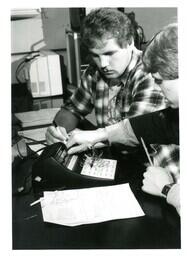 Two Students Working with Powerace Electronics Equipment (Part of the NMU Historic Photographs Collection)