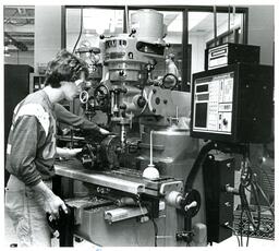 Student Operating a Crusader 5 Mill (Part of the NMU Historic Photographs Collection)