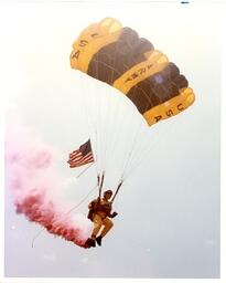 Man Parachuting with American Flag and USA Army Parachute (Part of the NMU Historic Photographs Collection)