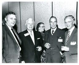 Four Board Members Posing for Photo at Gathering (Part of the NMU Historic Photographs Collection)