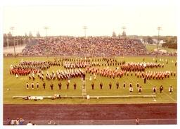 Several Marching Bands Playing Together at Football Game (Part of the NMU Historic Photographs Collection)