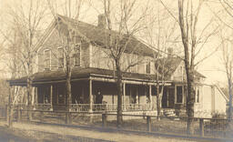 House with people on porch (1 of 2)