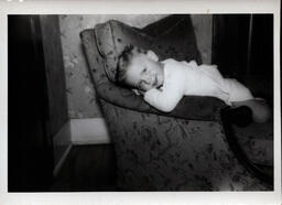 Boy Leaning on Chair