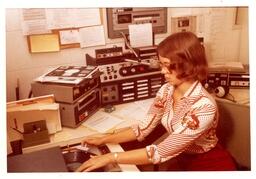 Student Plays Record at Radio Station (Part of the NMU Historic Photographs Collection)