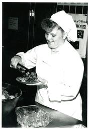 Culinary Student Placing Salad on Plate (Part of the NMU Historic Photographs Collection)